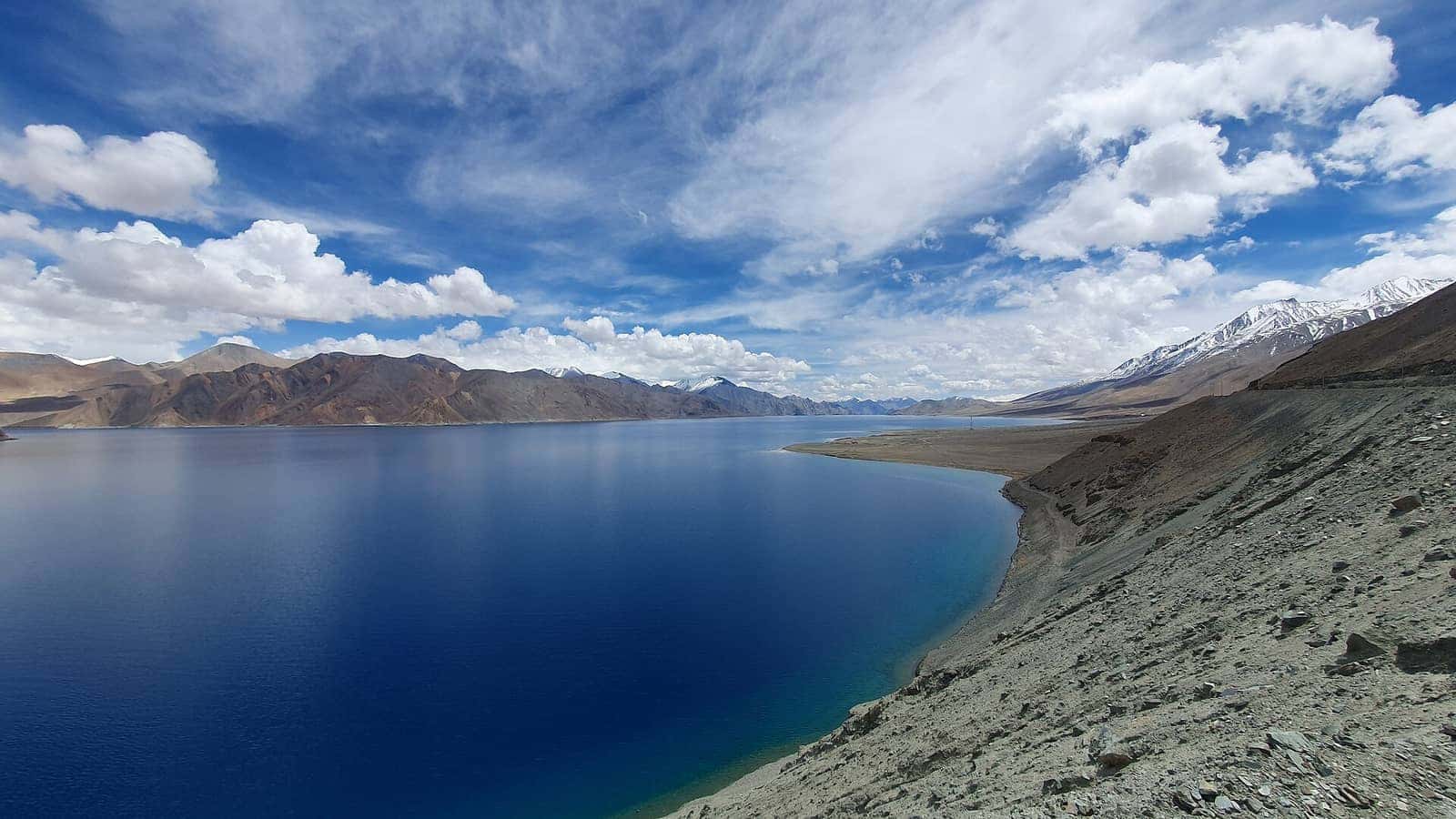 Deep blue Pangong Tso ringed by barren mountains in Ladakh
