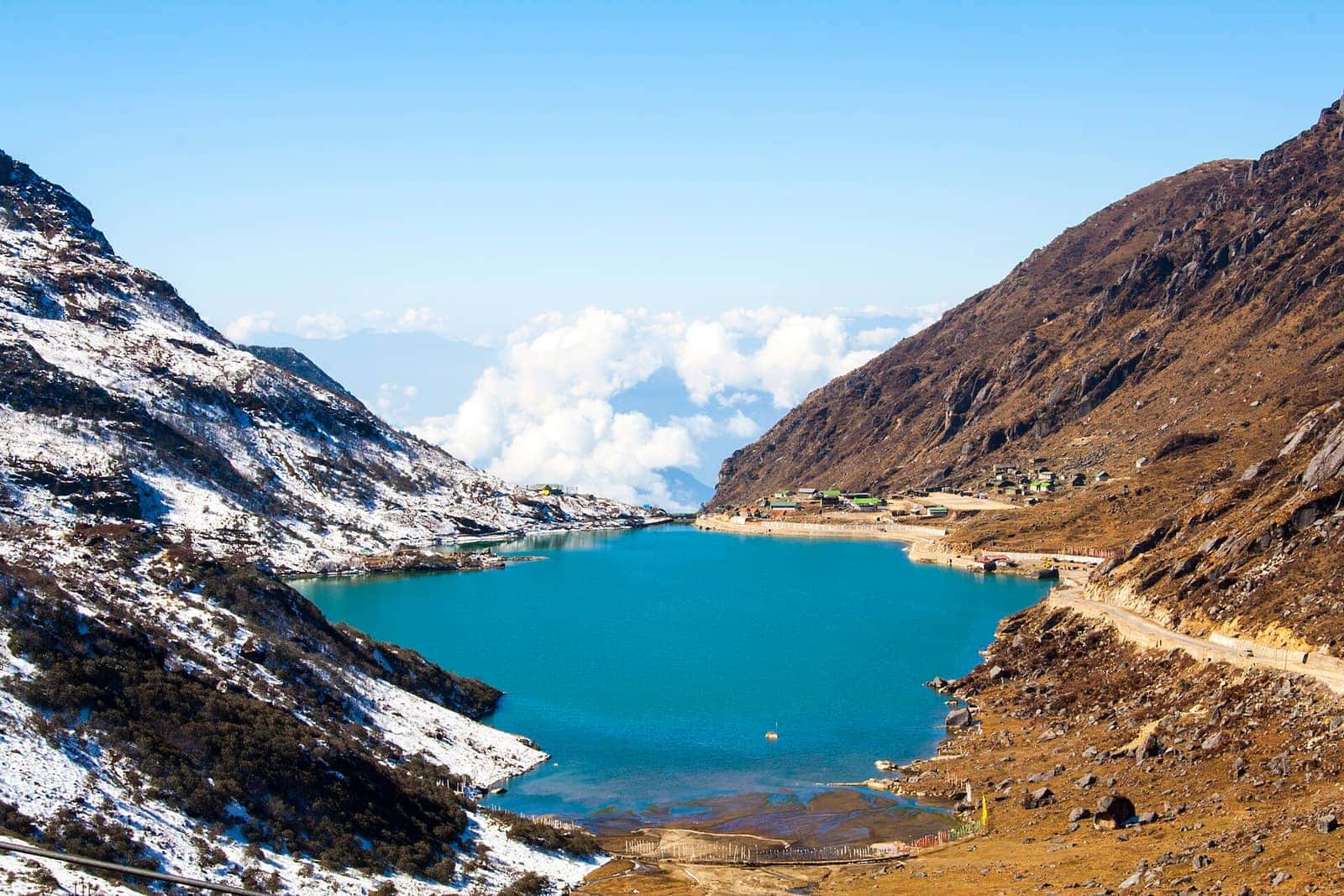 Turquoise Tsomgo (Changu) Lake between rugged slopes in East Sikkim
